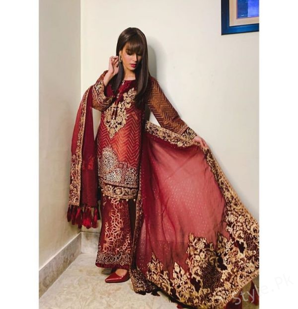 Iqra Aziz wearing formal reddish maroon ensemble by Maria 
